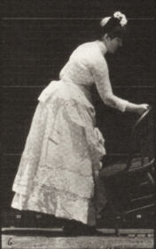 Plate 243 Placing a chair and sitting, parasol in left hand — figure reference